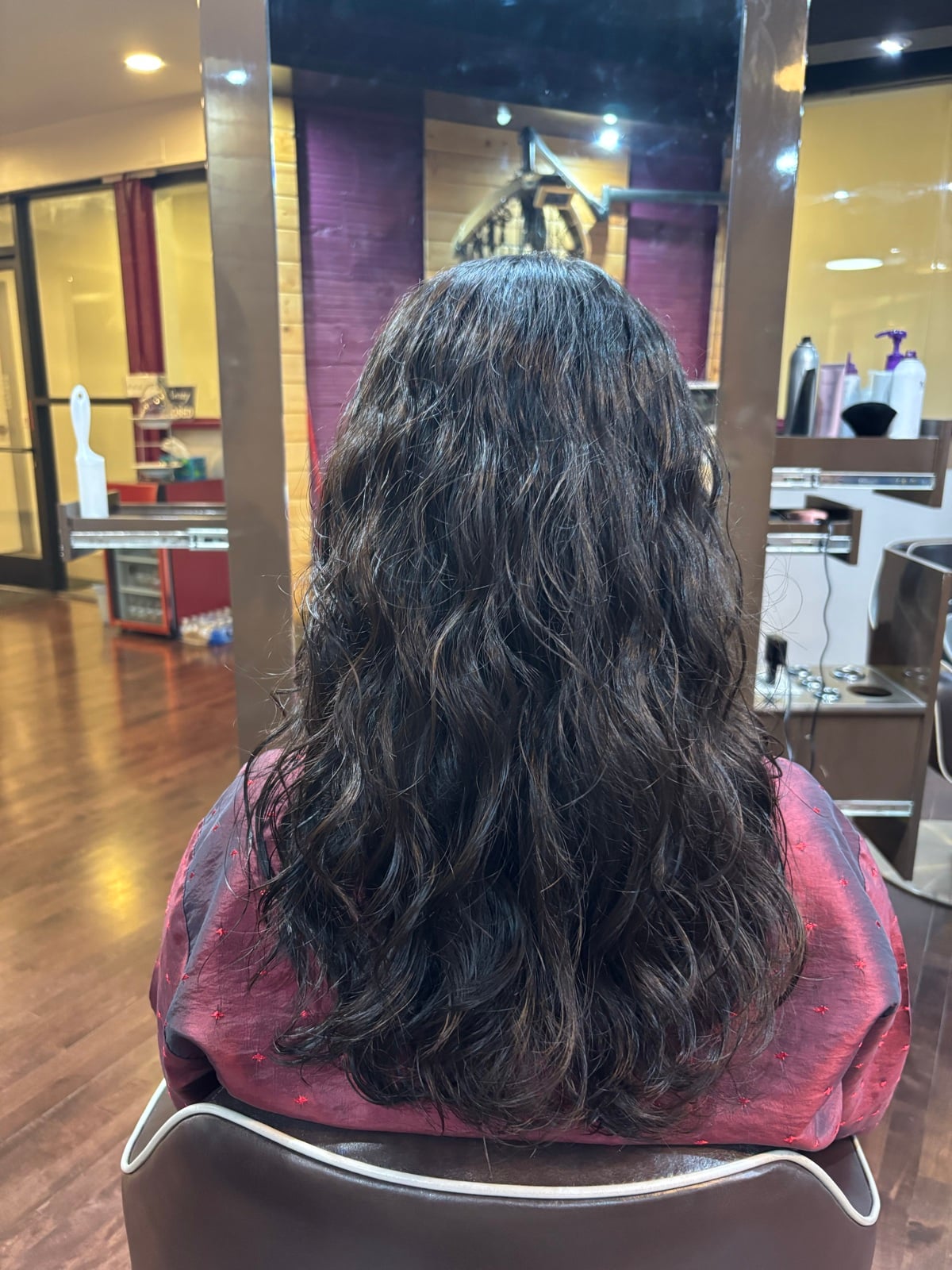 After a women's cut, perm, and blow dry at Hair Salon K
